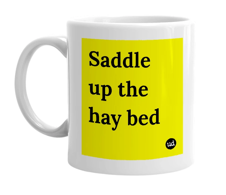 White mug with 'Saddle up the hay bed' in bold black letters