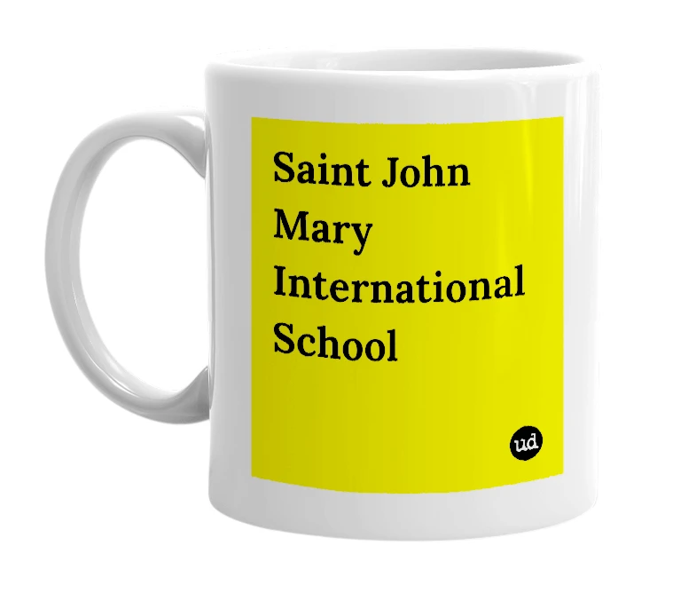 White mug with 'Saint John Mary International School' in bold black letters