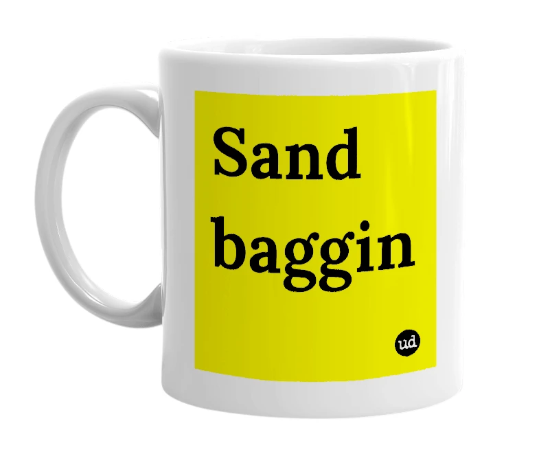 White mug with 'Sand baggin' in bold black letters