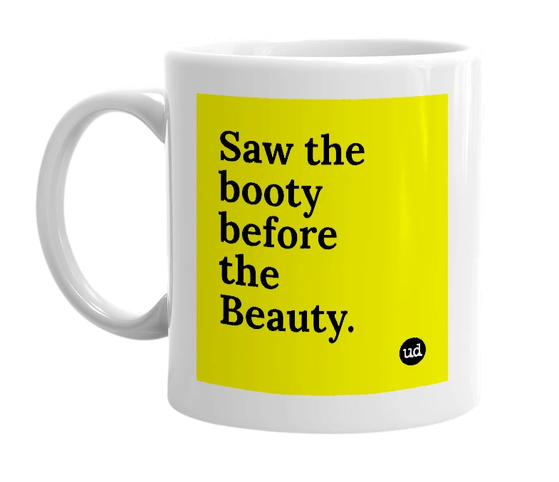 White mug with 'Saw the booty before the Beauty.' in bold black letters
