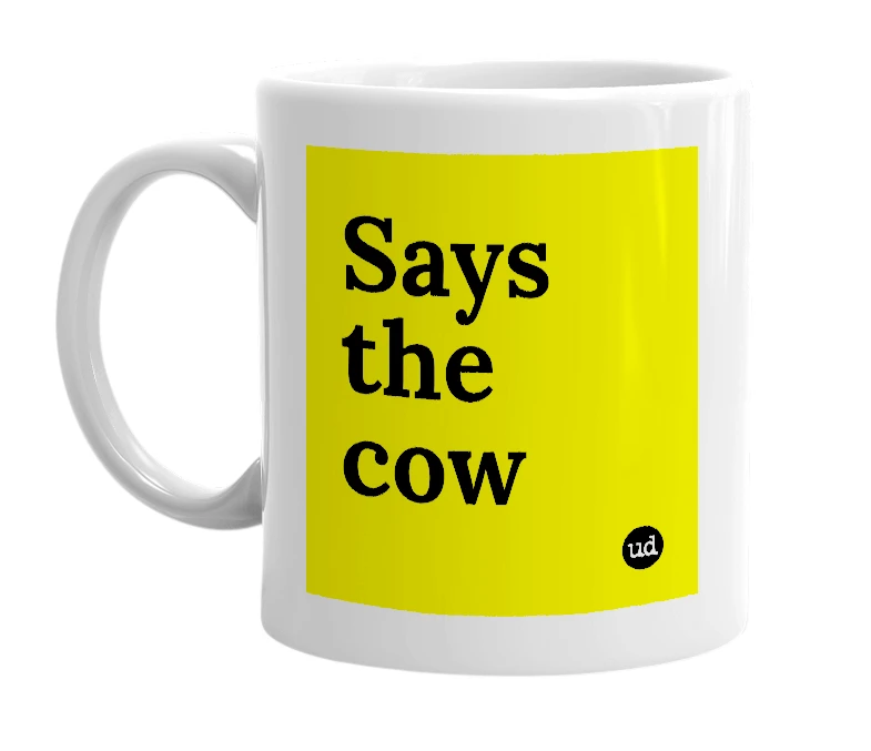 White mug with 'Says the cow' in bold black letters