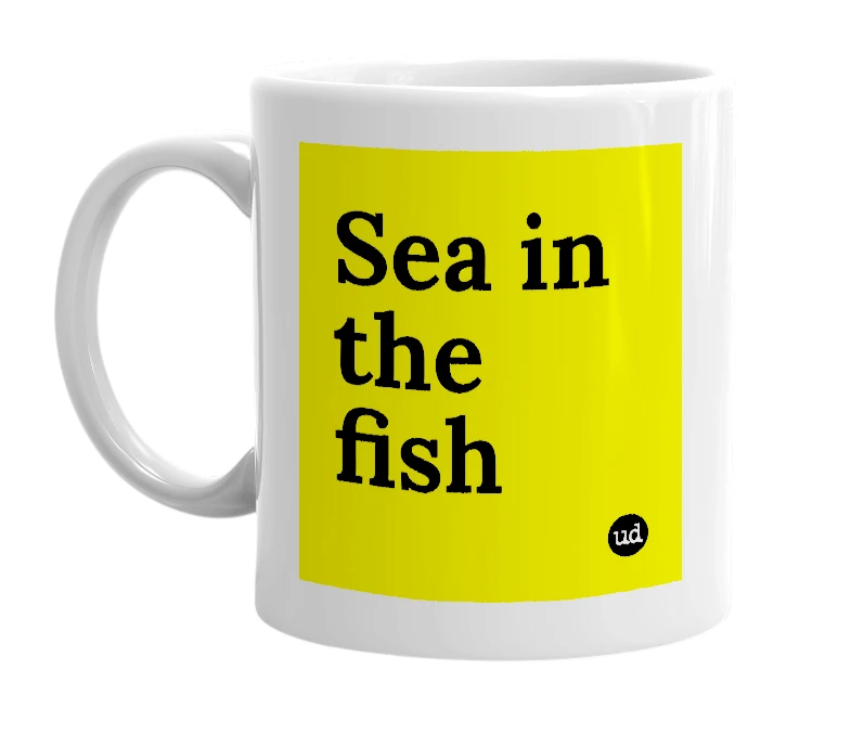 White mug with 'Sea in the fish' in bold black letters