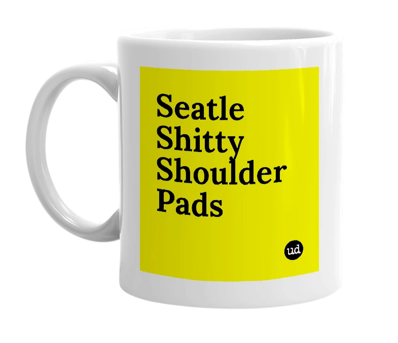 White mug with 'Seatle Shitty Shoulder Pads' in bold black letters