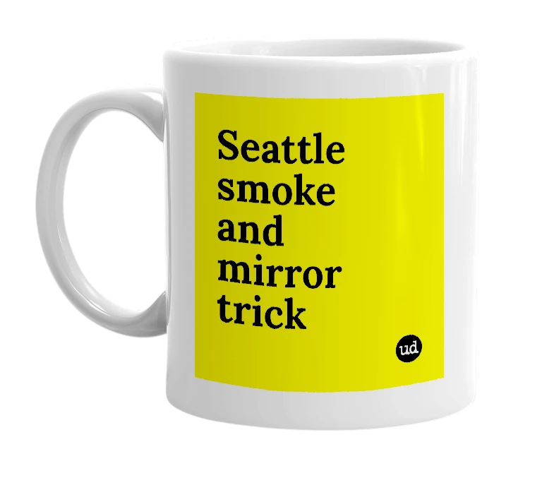 White mug with 'Seattle smoke and mirror trick' in bold black letters