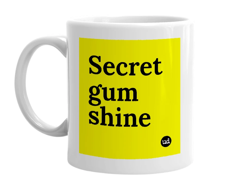 White mug with 'Secret gum shine' in bold black letters