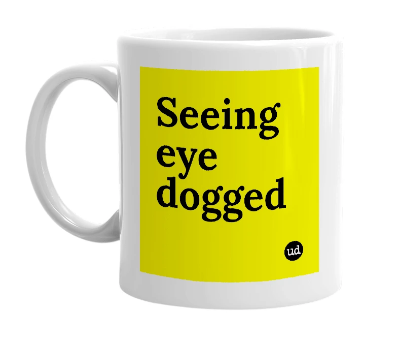 White mug with 'Seeing eye dogged' in bold black letters