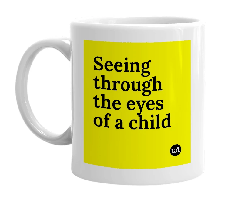 White mug with 'Seeing through the eyes of a child' in bold black letters