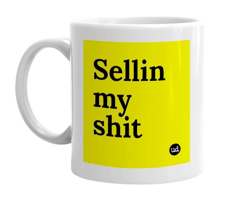 White mug with 'Sellin my shit' in bold black letters