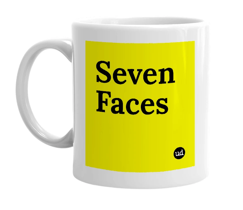 White mug with 'Seven Faces' in bold black letters