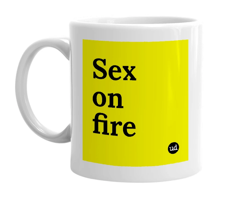 White mug with 'Sex on fire' in bold black letters