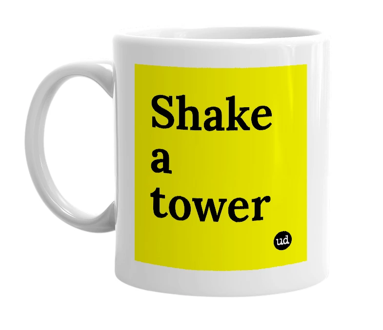White mug with 'Shake a tower' in bold black letters