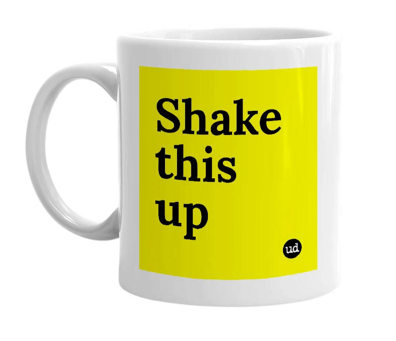 White mug with 'Shake this up' in bold black letters