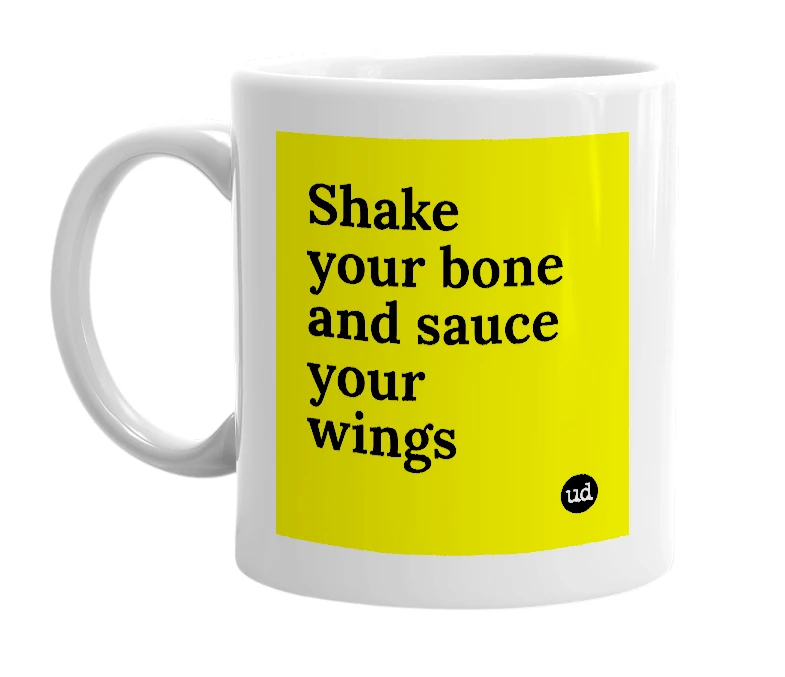 White mug with 'Shake your bone and sauce your wings' in bold black letters