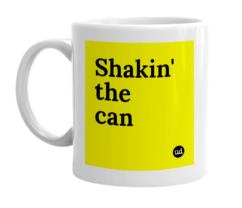 White mug with 'Shakin' the can' in bold black letters