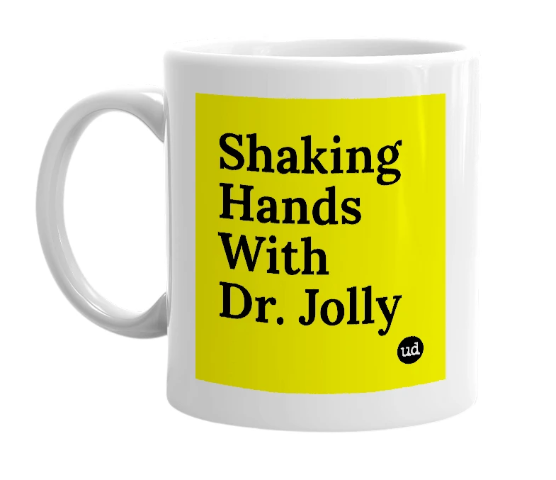 White mug with 'Shaking Hands With Dr. Jolly' in bold black letters