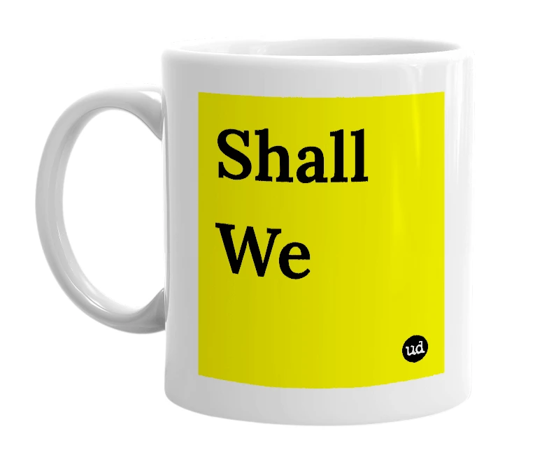 White mug with 'Shall We' in bold black letters