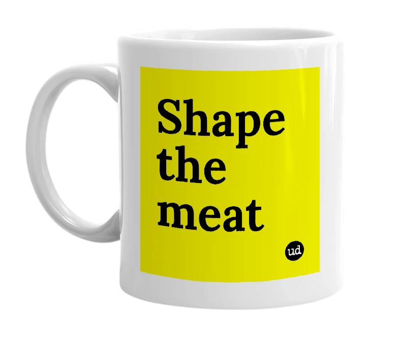 White mug with 'Shape the meat' in bold black letters