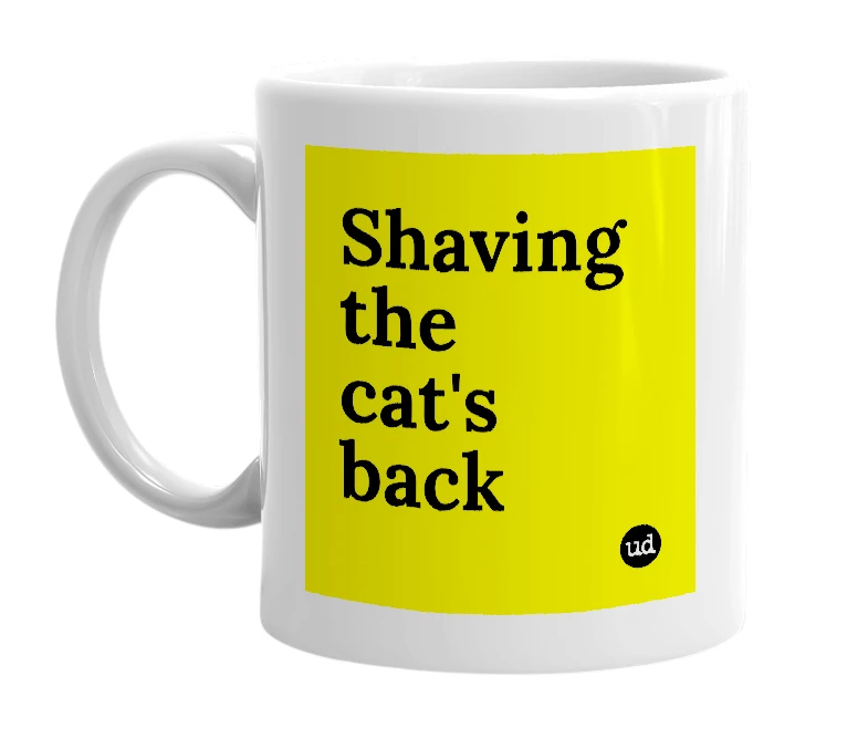 White mug with 'Shaving the cat's back' in bold black letters