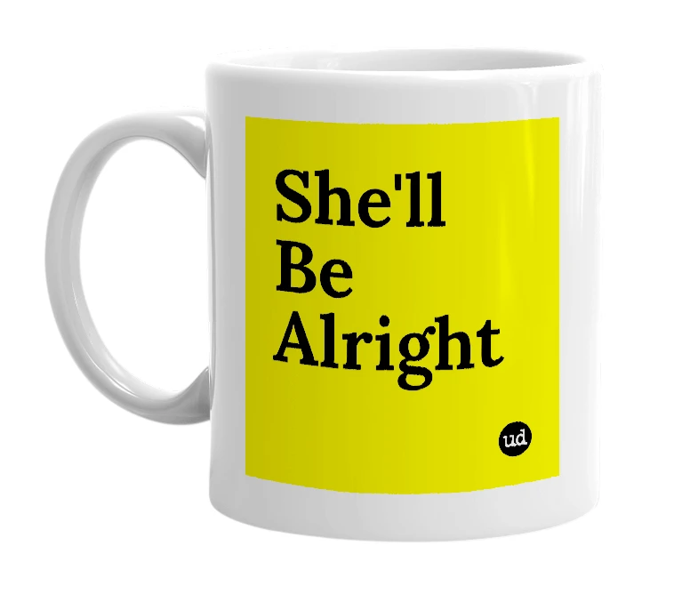 White mug with 'She'll Be Alright' in bold black letters