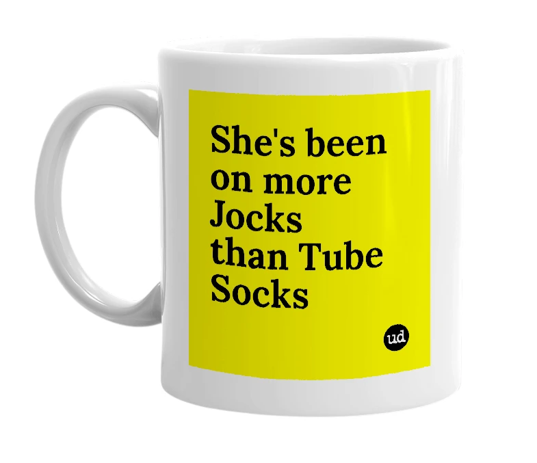 White mug with 'She's been on more Jocks than Tube Socks' in bold black letters
