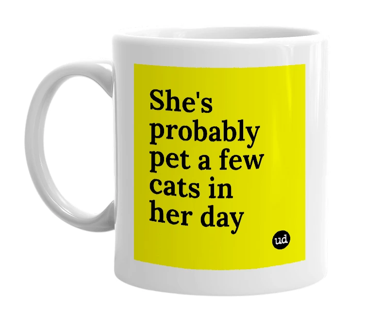 White mug with 'She's probably pet a few cats in her day' in bold black letters