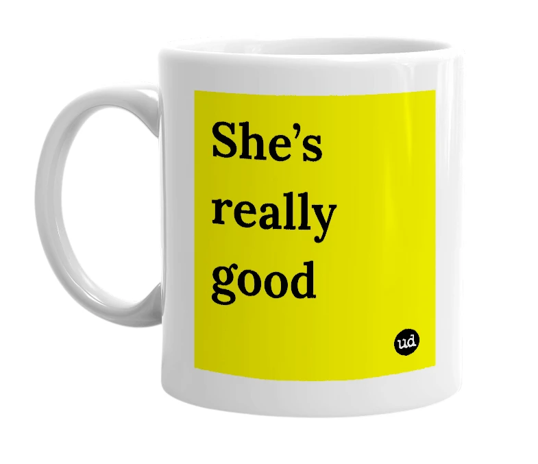 White mug with 'She’s really good' in bold black letters
