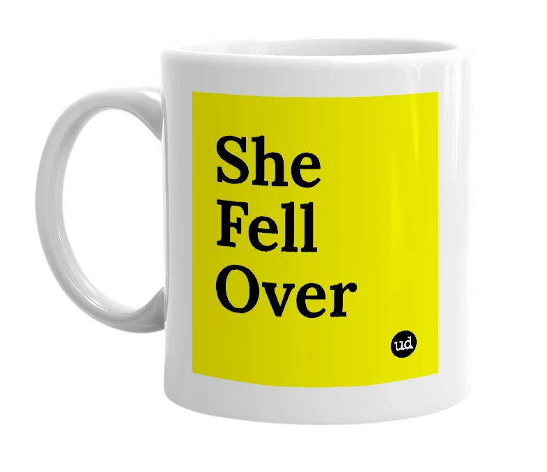 White mug with 'She Fell Over' in bold black letters
