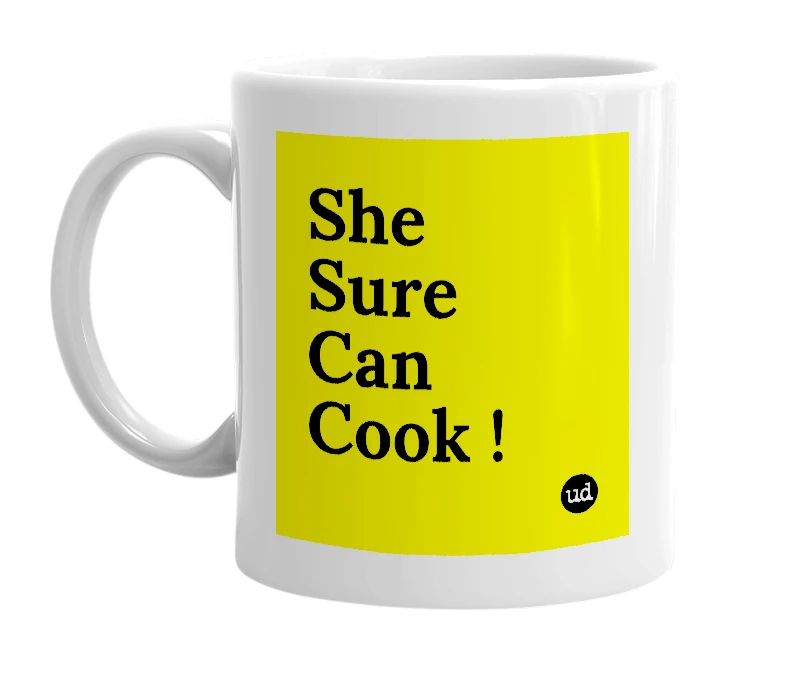 White mug with 'She Sure Can Cook !' in bold black letters
