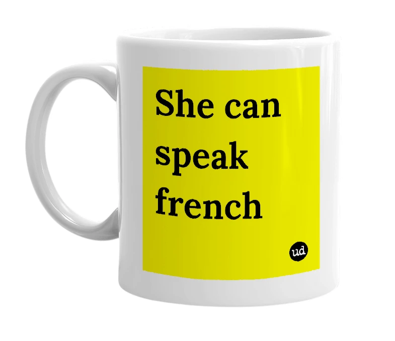 White mug with 'She can speak french' in bold black letters