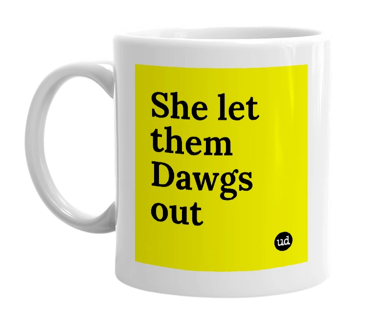 White mug with 'She let them Dawgs out' in bold black letters