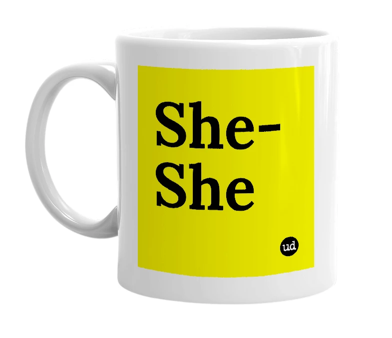 White mug with 'She-She' in bold black letters
