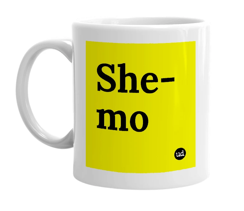 White mug with 'She-mo' in bold black letters