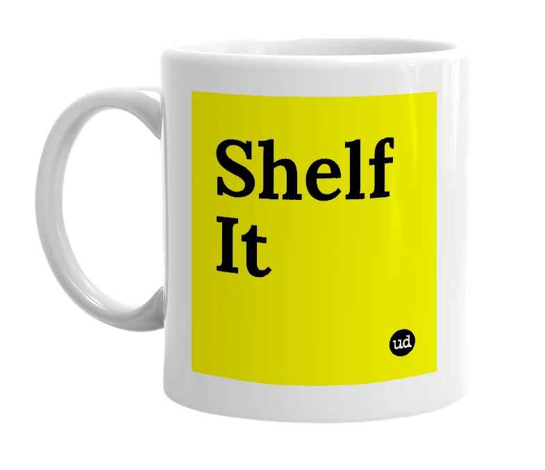 White mug with 'Shelf It' in bold black letters