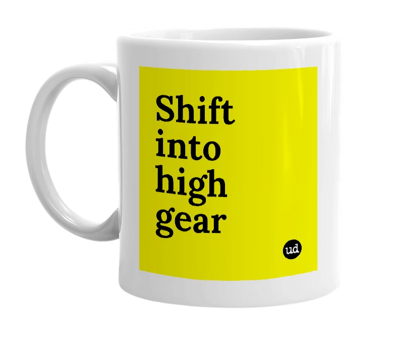 White mug with 'Shift into high gear' in bold black letters