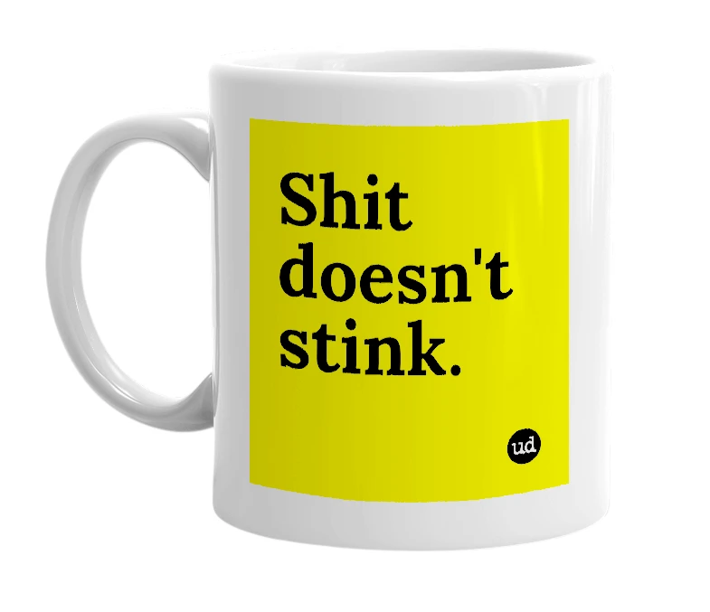 White mug with 'Shit doesn't stink.' in bold black letters