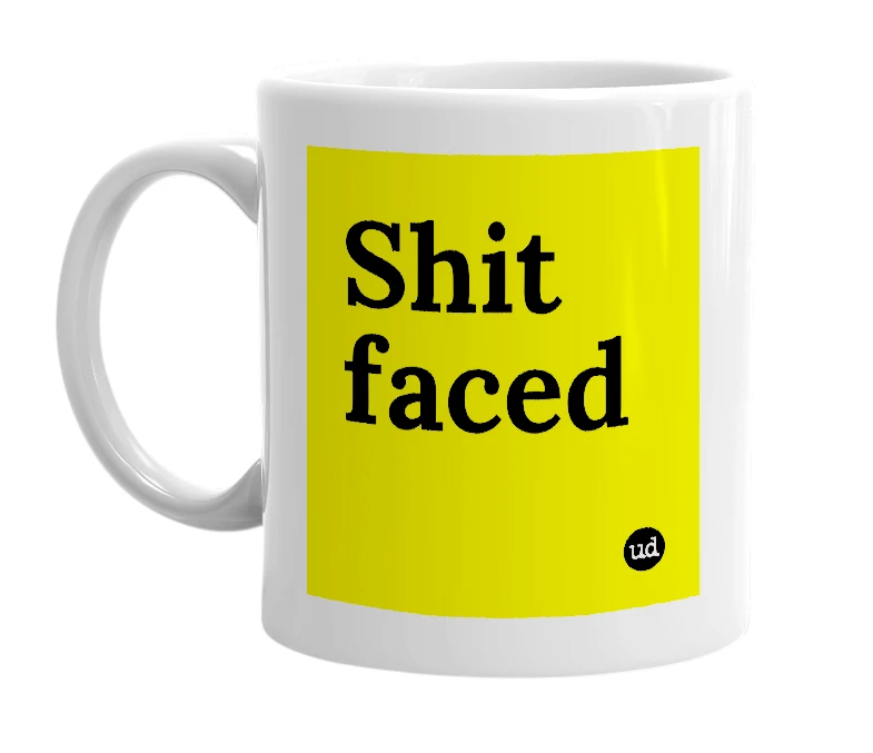 White mug with 'Shit faced' in bold black letters