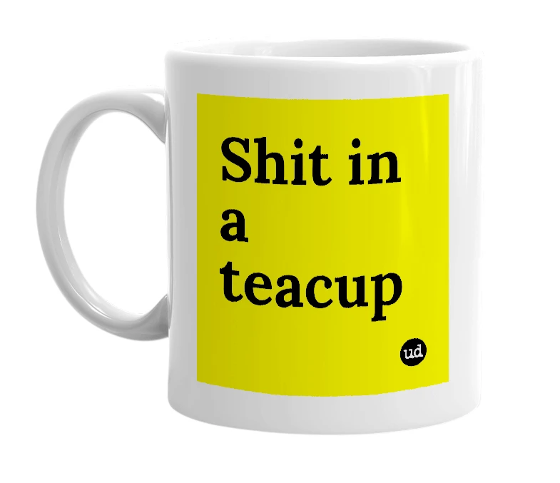 White mug with 'Shit in a teacup' in bold black letters