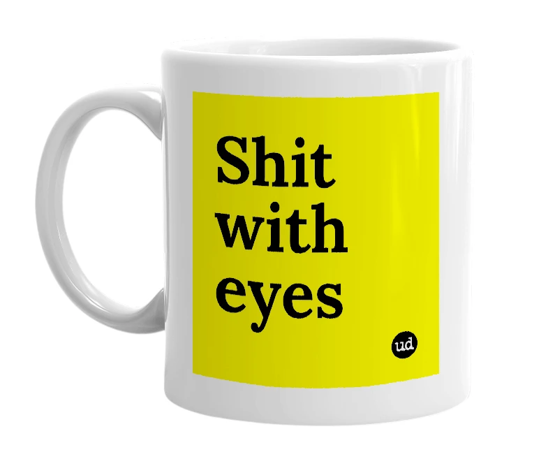 White mug with 'Shit with eyes' in bold black letters