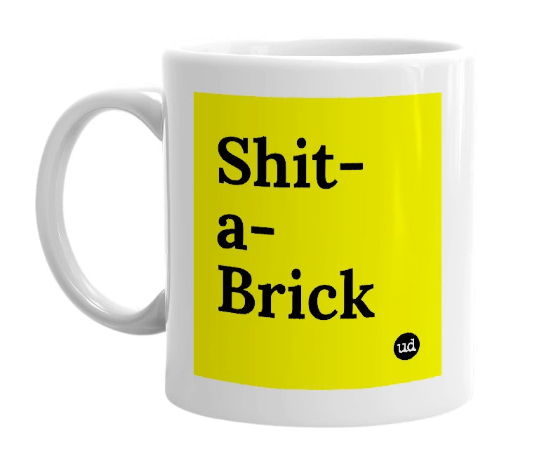 White mug with 'Shit-a-Brick' in bold black letters