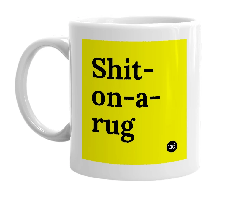 White mug with 'Shit-on-a-rug' in bold black letters