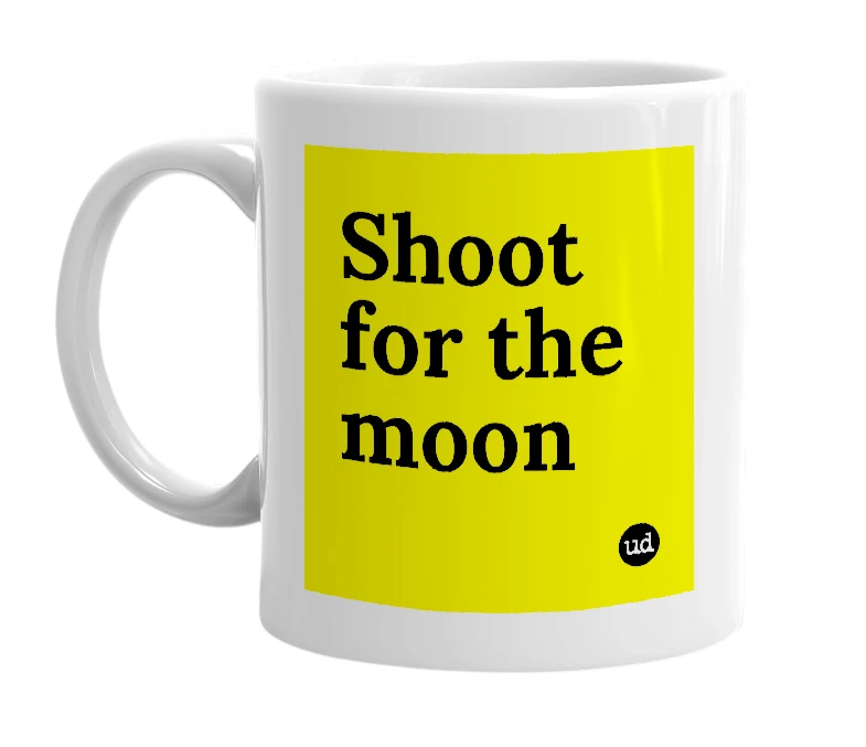 White mug with 'Shoot for the moon' in bold black letters