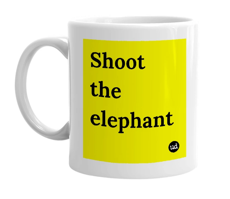 White mug with 'Shoot the elephant' in bold black letters