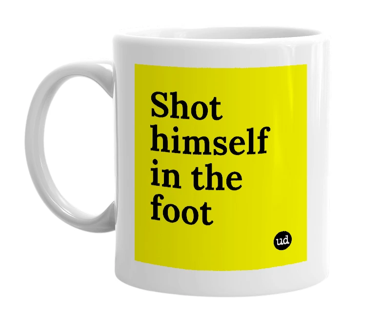White mug with 'Shot himself in the foot' in bold black letters