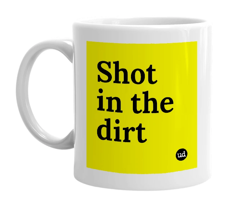 White mug with 'Shot in the dirt' in bold black letters