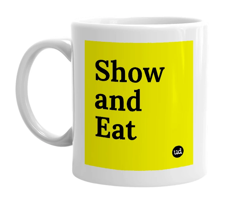 White mug with 'Show and Eat' in bold black letters