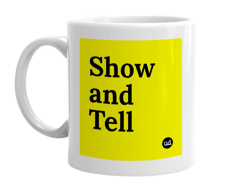 White mug with 'Show and Tell' in bold black letters
