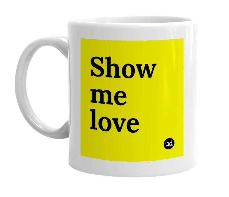 White mug with 'Show me love' in bold black letters