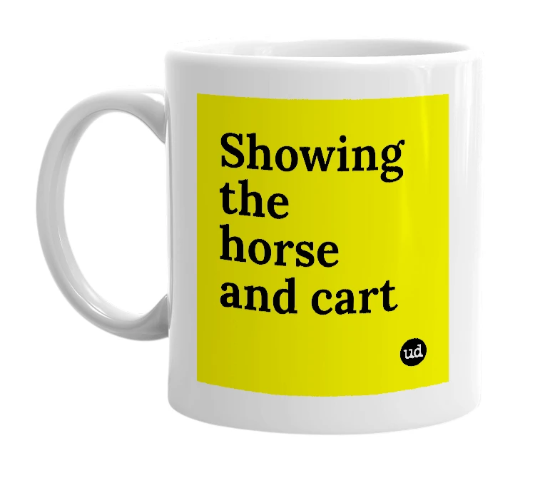 White mug with 'Showing the horse and cart' in bold black letters