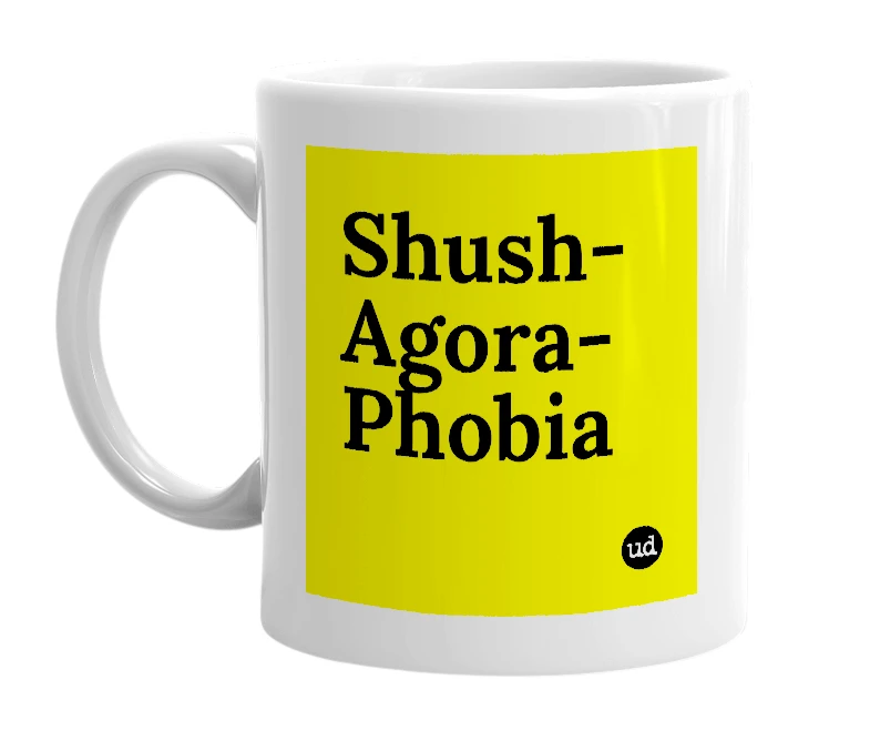 White mug with 'Shush-Agora-Phobia' in bold black letters