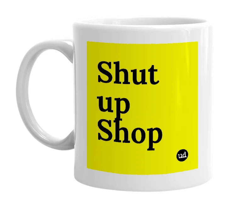 White mug with 'Shut up Shop' in bold black letters